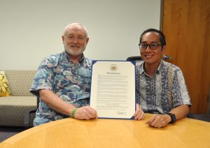 Hawaii CIO Douglas Murdock and Chief Information Security Officer Vincent Hoang displaying the 2023 Cybersecurity Month proclamation.